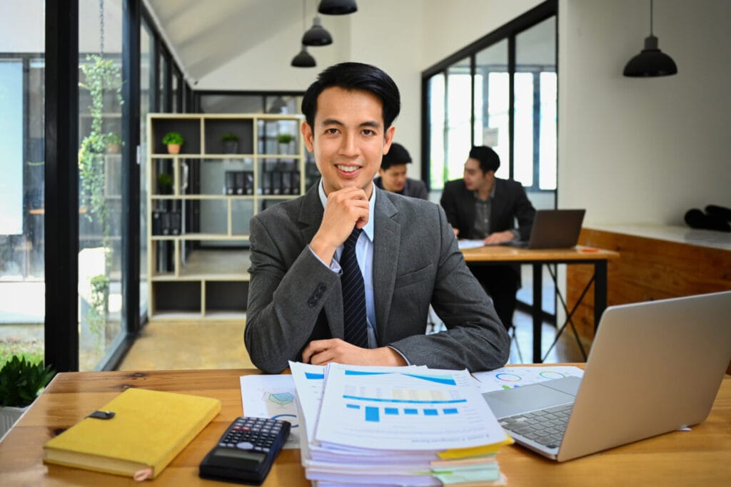 Business accountant working at desk with financial reports
